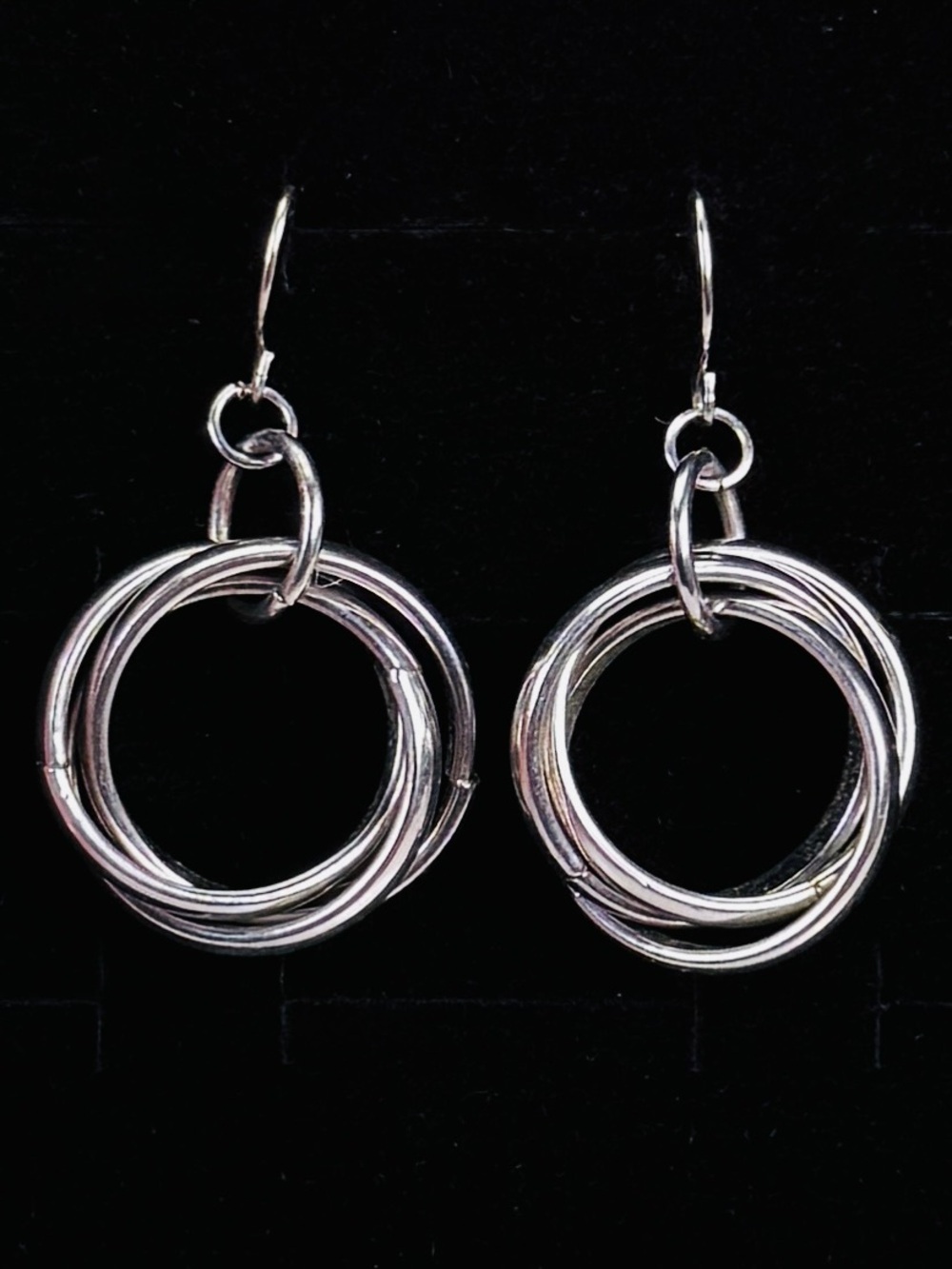 Weighted Silvertone floating circle pierced earrings